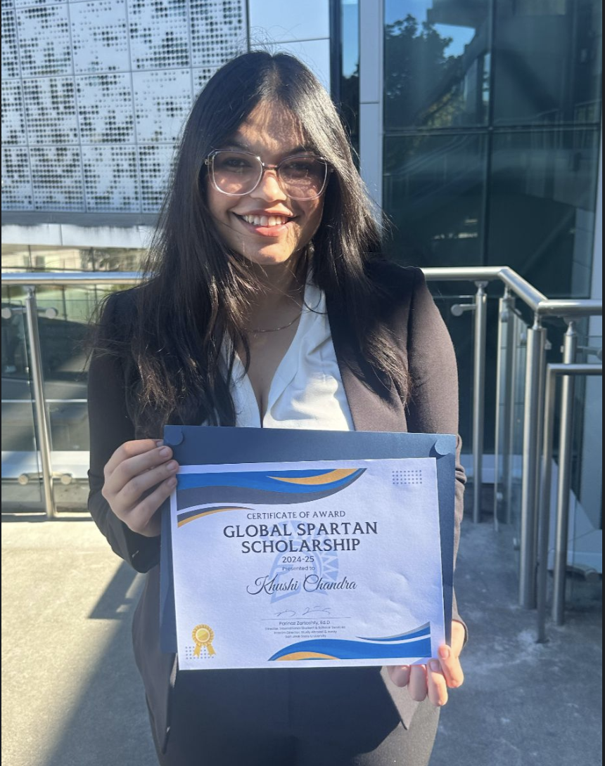 Khushi holding certificate